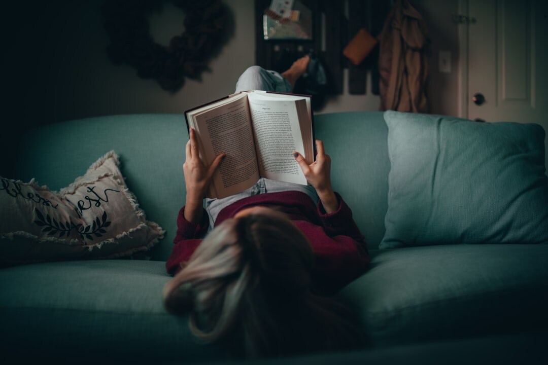 person reading mystery book